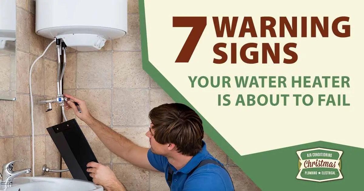Image of a plumber checking an electric boiler, featuring Christmas Air Conditioning and Plumbing and highlighting the 7 warning signs your water heater is about to fail.