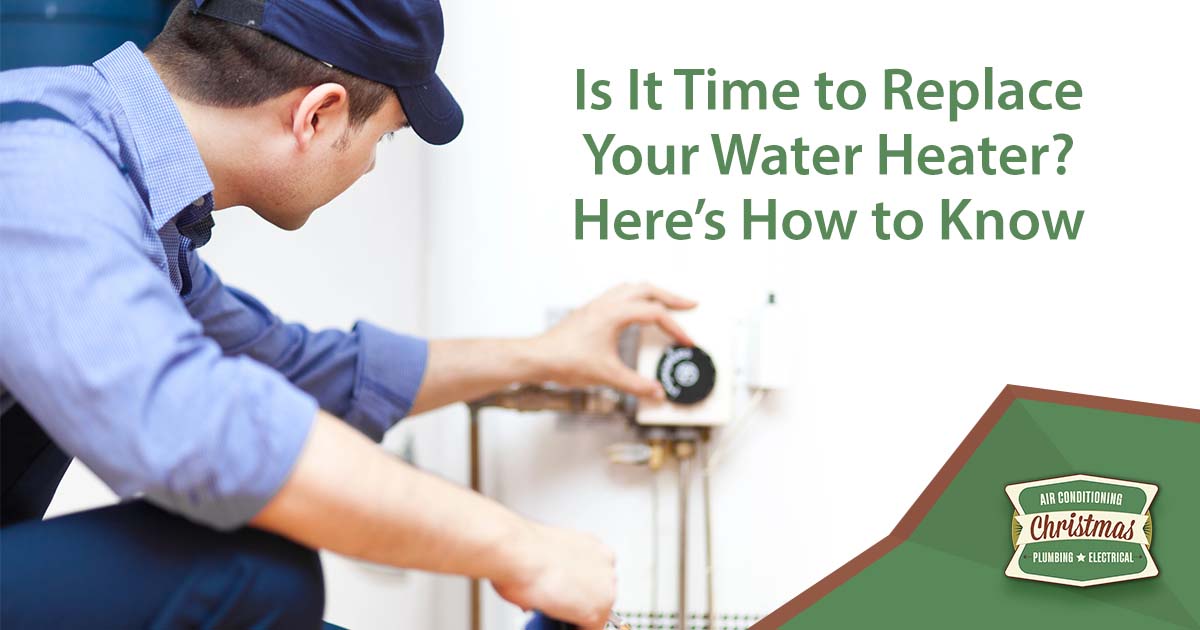 Image of hot water heater service in progress, featuring Christmas Air Conditioning and highlighting signs that indicate it may be time to replace your water heater.