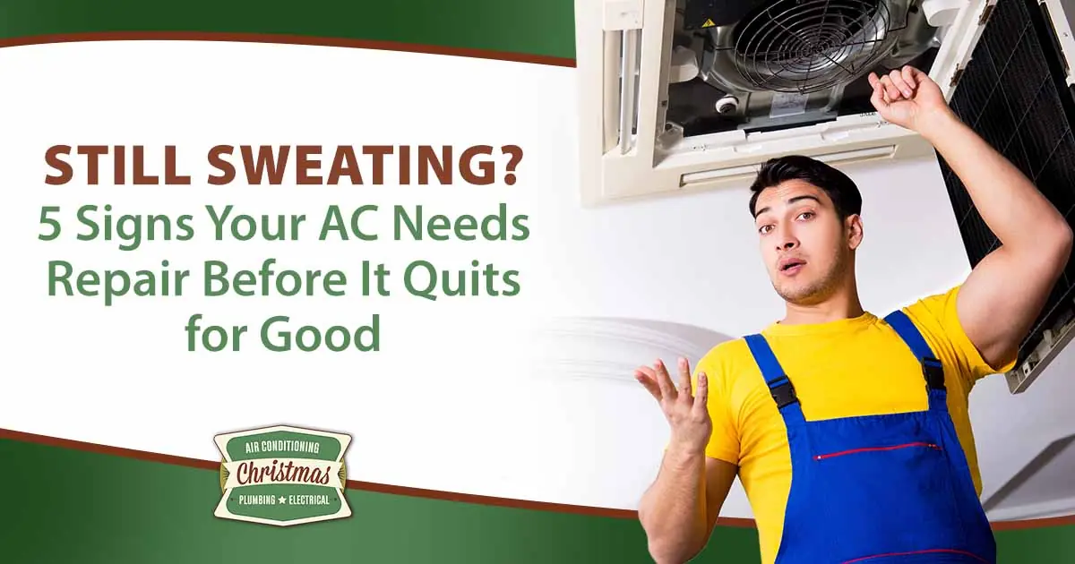 Image of a repairman fixing a ceiling air conditioning unit, featuring Christmas Air Conditioning and Plumbing and highlighting key signs your AC needs repair before it stops working completely.