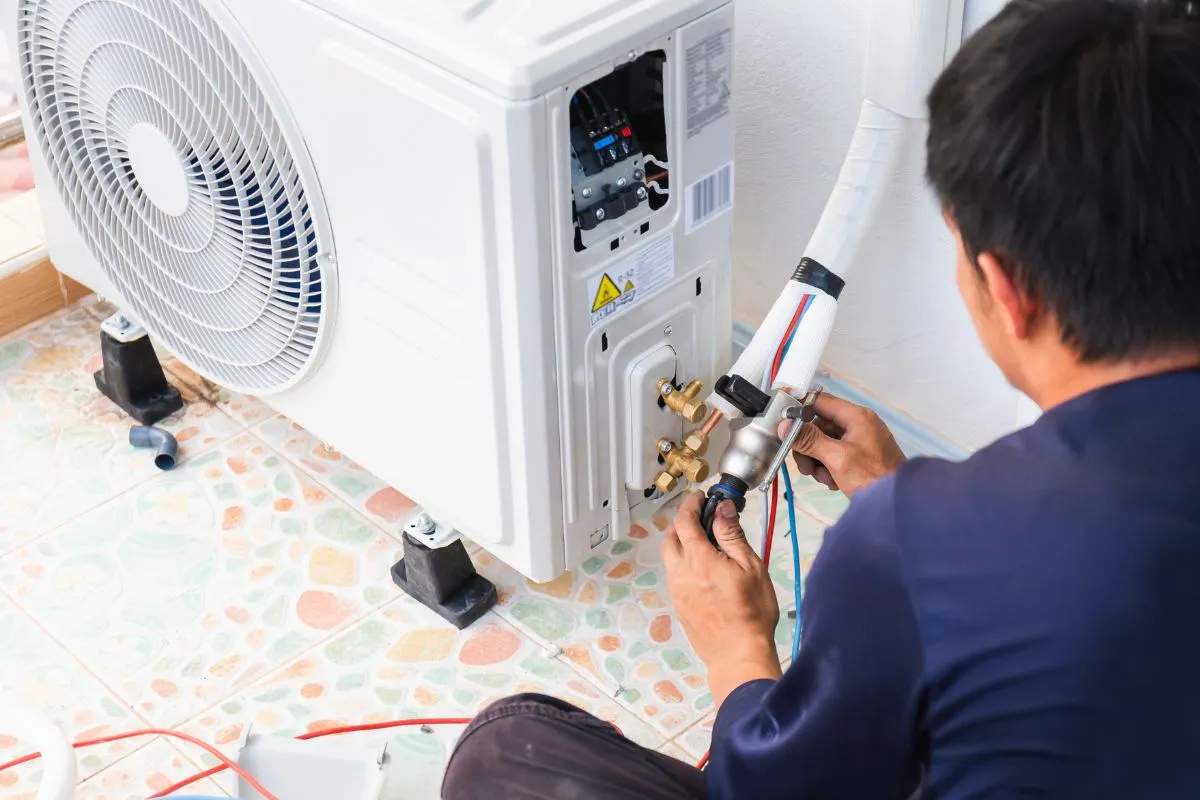 HVAC tech connecting refrigerant lines on an outdoor unit for ac repair fort worth tx