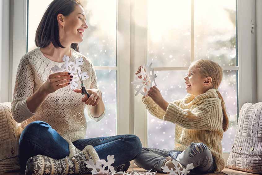 Image of a mom and daughter, featuring Christmas Air Conditioning and Heating. The image highlights the importance of winterizing HVAC systems, aligning with the page's context of preparing homes for winter.